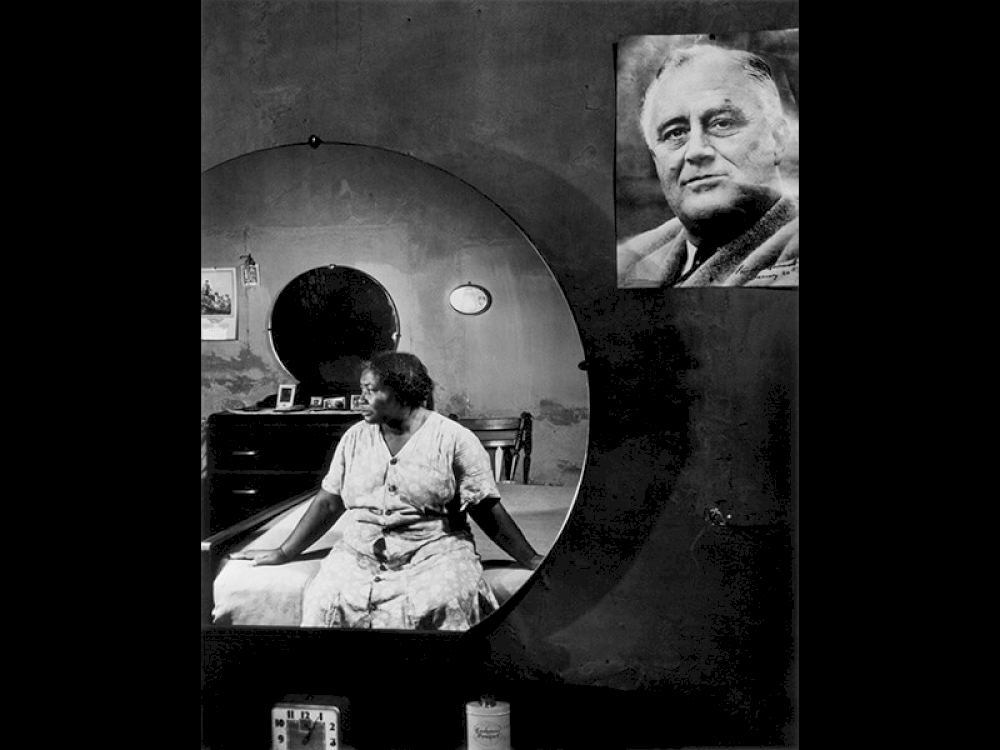 Negro Woman in Her Bedroom, Washington, D.C., 1942 - Photograph by Gordon Parks ©The Gordon Parks Foundation