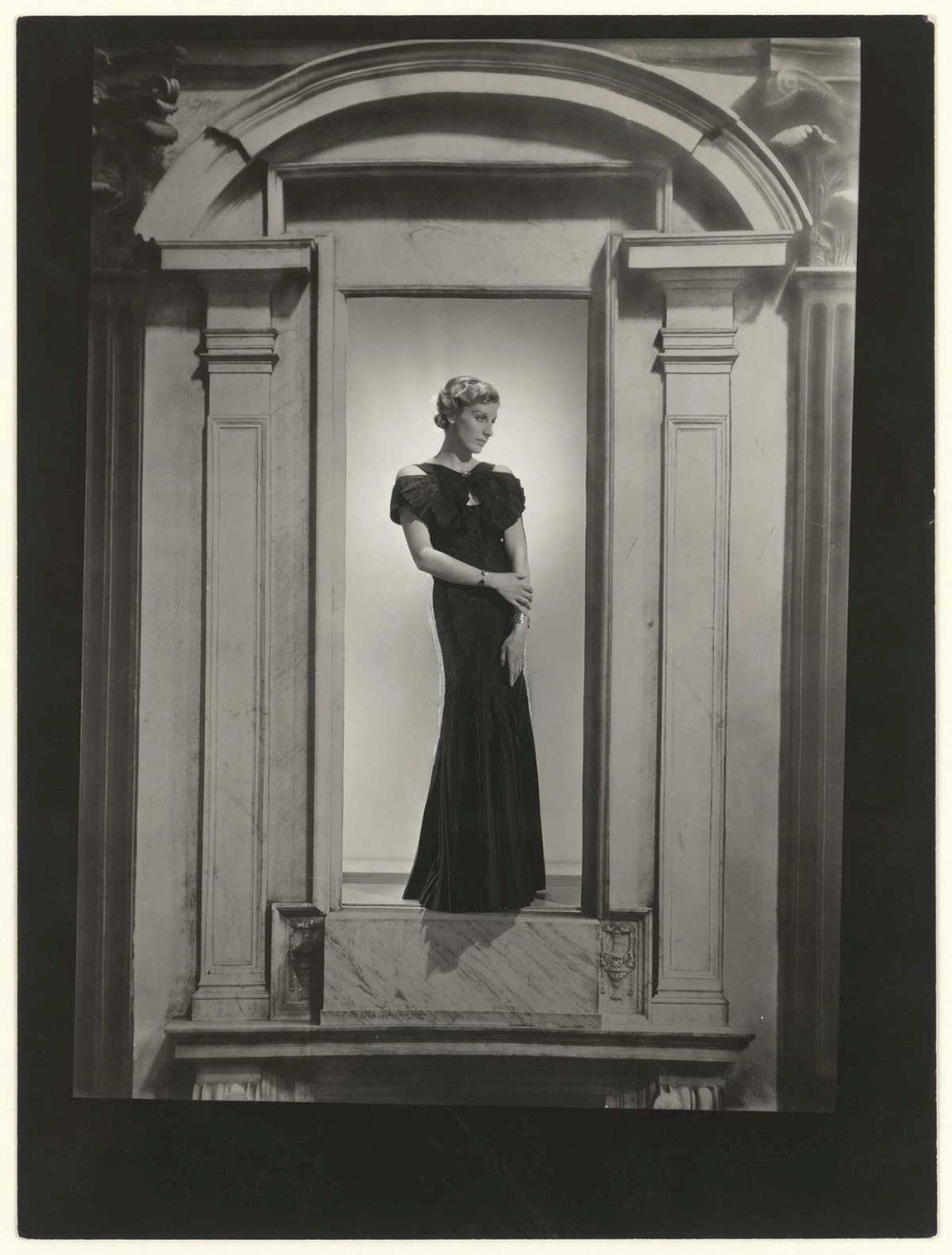 George Hoyningen-Huene, Woman in Portico, Chanel Fashion, ca. 1935 © Horst; Estate of Hoyningen-Huene
