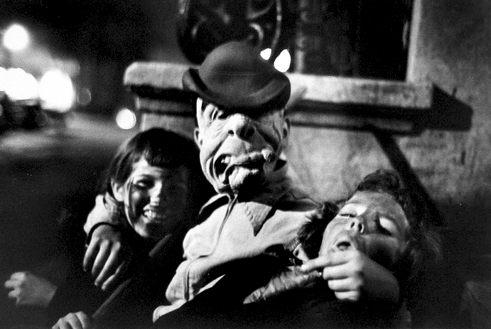 Saul Leiter, Halloween, 3 people in masks, ca. 1952, © Saul Leiter Foundation