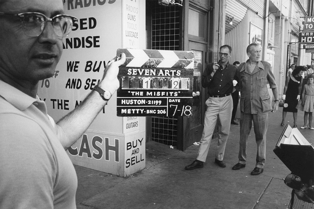 USA. Reno, NV. Playwright Arthur Miller and director John Huston on street during filming of ‘The Misfits’. 1960. © Inge Morath / Magnum Photos / courtesy CLAIRbyKahn